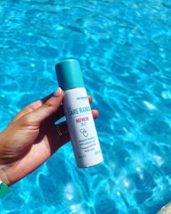 Maryrose holds a can of "The Care Range Refresh 3in1" with a pool in the background.