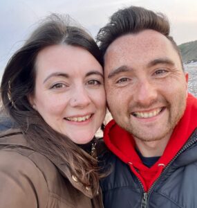 Amy and her husband smiling in their selfie!