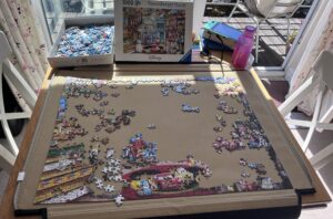 A table displaying a colourful jigsaw, how Amy de-stresses!
